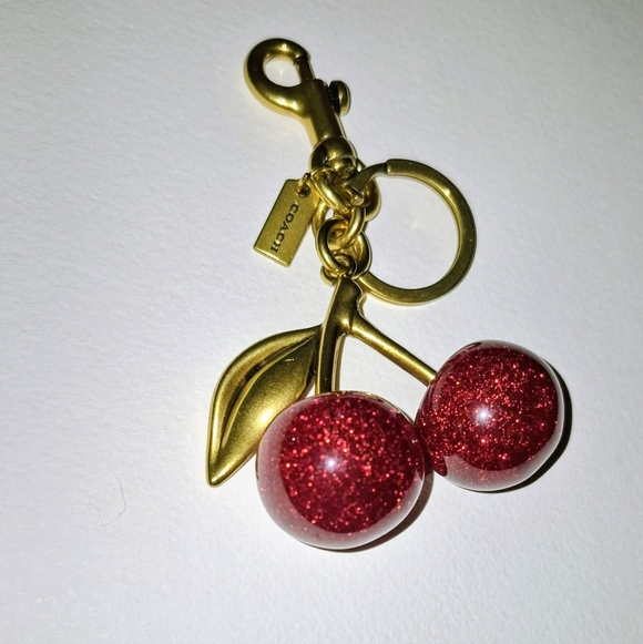 Coach Glitter Cherry Keychain with Gold and Green Accents - Picture 2 of 6